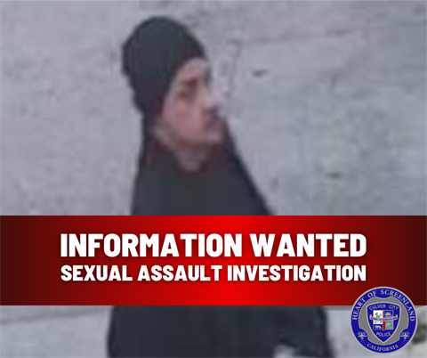 Image of man wearing black beanie and black clothing with the words 